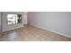 Inviting living room featuring a large window and ceramic tile flooring at 6504 W Cochise Dr, Glendale, AZ 85302