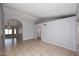 Bright living room boasts ceramic tile floors, neutral paint, and modern design at 6504 W Cochise Dr, Glendale, AZ 85302