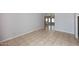 Bright living room with ceramic tile floors and a glimpse of a ceiling fan at 6504 W Cochise Dr, Glendale, AZ 85302