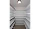 Walk-in pantry with plenty of shelving space for optimal organization at 6504 W Cochise Dr, Glendale, AZ 85302