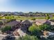 Scenic aerial image of a community with a golf course, and a house with a spacious driveway at 654 E Taylor Trl, San Tan Valley, AZ 85143