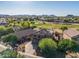 Spacious house aerial view with lovely golf course and desert mountain views at 654 E Taylor Trl, San Tan Valley, AZ 85143