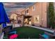 Backyard view of patio, grassy area and beautiful desert sky at 654 E Taylor Trl, San Tan Valley, AZ 85143