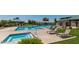 Community pool and jacuzzi with sun loungers for relaxing in a luxurious outdoor setting at 654 E Taylor Trl, San Tan Valley, AZ 85143