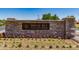 Stone monument sign with 'Indigo Sky Recreation Center' on beautifully landscaped grounds at 654 E Taylor Trl, San Tan Valley, AZ 85143