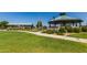 Picturesque gazebo and picnic area surrounded by lush green grass and meticulously kept landscaping at 654 E Taylor Trl, San Tan Valley, AZ 85143