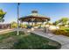 Charming gazebo with picnic tables, offering a peaceful gathering space amid landscaped grounds at 654 E Taylor Trl, San Tan Valley, AZ 85143
