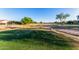 Scenic view of a golf course and trees in a residential neighborhood on a bright day at 654 E Taylor Trl, San Tan Valley, AZ 85143
