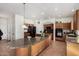 Open kitchen with island, granite countertops, and modern appliances, perfect for cooking at 654 E Taylor Trl, San Tan Valley, AZ 85143