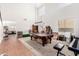 Spacious living room featuring a high ceiling, bright windows, and a pool table at 654 E Taylor Trl, San Tan Valley, AZ 85143