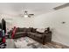 Spacious living room featuring a comfortable, large sectional couch and neutral-colored decor at 654 E Taylor Trl, San Tan Valley, AZ 85143