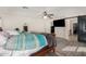 Bright main bedroom with a barn door to the ensuite bathroom at 654 E Taylor Trl, San Tan Valley, AZ 85143