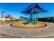 Fun playground with colorful equipment and shade, set in a well-maintained communal area at 654 E Taylor Trl, San Tan Valley, AZ 85143