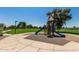 Playground with slides, climbing structure, and soft landing surface near a pond and green space at 654 E Taylor Trl, San Tan Valley, AZ 85143