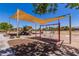 Community playground with slides, swings, and covered play areas, perfect for Gathering fun at 654 E Taylor Trl, San Tan Valley, AZ 85143