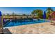 Backyard pool with serene blue water, tiled surround, and a beautiful view of the green golf course at 654 E Taylor Trl, San Tan Valley, AZ 85143