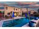 Backyard pool and patio with covered seating area at 654 E Taylor Trl, San Tan Valley, AZ 85143