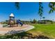 Community recreation area featuring a playground, gazebo, and picnic spaces amid lush greenery at 654 E Taylor Trl, San Tan Valley, AZ 85143