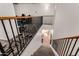 Contemporary staircase with metal railing leading to the upper level living spaces at 654 E Taylor Trl, San Tan Valley, AZ 85143
