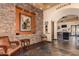 Elegant terrace entrance with stone accents, artwork and a glimpse into the dining area at 654 E Taylor Trl, San Tan Valley, AZ 85143