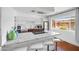 Stylish kitchen featuring a granite island with seating, modern appliances, and ample counter space, ideal for culinary enthusiasts at 6906 E 4Th St # 4, Scottsdale, AZ 85251