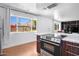 Bright kitchen featuring stainless steel appliances, granite countertops, and natural light from a large window at 6906 E 4Th St # 4, Scottsdale, AZ 85251