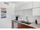 Well-equipped kitchen with granite counters, stainless steel sink, and modern cabinetry, perfect for everyday meal preparation at 6906 E 4Th St # 4, Scottsdale, AZ 85251