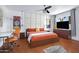 Stylish main bedroom with an adjacent workspace, modern decor, a television, and neutral wall art at 6906 E 4Th St # 4, Scottsdale, AZ 85251