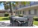 Inviting outdoor patio with a dining table and seating, perfect for enjoying al fresco meals in a serene setting at 6906 E 4Th St # 4, Scottsdale, AZ 85251