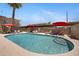 Sparkling community pool surrounded by lounge chairs and red umbrellas offers a refreshing escape on sunny days at 6906 E 4Th St # 4, Scottsdale, AZ 85251