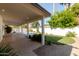 View of the backyard from the covered patio overlooking the pool and well-kept landscaping at 7127 N 79Th St, Scottsdale, AZ 85258