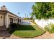 Backyard featuring a pool, patio, and artificial turf surrounded by mature landscaping at 7127 N 79Th St, Scottsdale, AZ 85258