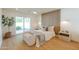 Serene bedroom with a wood accent wall, sliding doors to the yard and stylish furnishings at 7127 N 79Th St, Scottsdale, AZ 85258