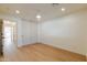 Bright bedroom features wood floors, recessed lighting, closet with sliding doors, and a ceiling fan at 7127 N 79Th St, Scottsdale, AZ 85258
