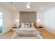 Cozy bedroom featuring a wood accent wall, neutral decor, and ample natural light at 7127 N 79Th St, Scottsdale, AZ 85258