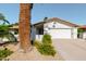 Well-maintained single story home with a two-car garage and desert landscaping at 7127 N 79Th St, Scottsdale, AZ 85258