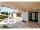Inviting front entrance featuring a tiled patio, black double doors, and a view of the tiered fountain at 7127 N 79Th St, Scottsdale, AZ 85258