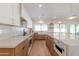 Stylish kitchen with white cabinets, an island, and modern appliances, perfect for cooking at 7127 N 79Th St, Scottsdale, AZ 85258