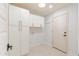 Functional laundry room with ample storage cabinets and a neutral color palette at 7127 N 79Th St, Scottsdale, AZ 85258