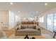 Bright, open-concept living room flows into the kitchen with natural light and modern furnishings at 7127 N 79Th St, Scottsdale, AZ 85258