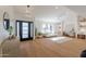Inviting living area with a front door, stylish decor, and large window with natural light at 7127 N 79Th St, Scottsdale, AZ 85258