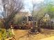 A view of the backyard with desert vegetation and landscaping showcasing a tranquil outdoor space at 717 W Lynwood St, Phoenix, AZ 85007