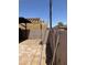 Backyard view with framed house under construction, utility pole and a fenced yard at 717 W Lynwood St, Phoenix, AZ 85007