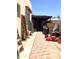 Exterior of the property, showcasing a paved backyard and partially covered area with storage at 717 W Lynwood St, Phoenix, AZ 85007