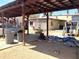 View of the backyard with a covered area, showing potential for outdoor activities and storage at 717 W Lynwood St, Phoenix, AZ 85007