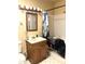 This bathroom features a sink, mirror, toilet, and shower at 717 W Lynwood St, Phoenix, AZ 85007