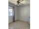 This bedroom features a window with curtains and tile flooring at 717 W Lynwood St, Phoenix, AZ 85007