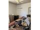 This bedroom is filled with furniture, boxes, and ladders at 717 W Lynwood St, Phoenix, AZ 85007