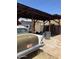 Backyard carport and classic car add character to this outdoor space, plus an Arizona license plate at 717 W Lynwood St, Phoenix, AZ 85007