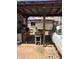 Open carport area with tools, perfect for workshop or storage needs, showing possibilities for customization at 717 W Lynwood St, Phoenix, AZ 85007
